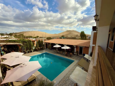 Outdoor pool, open 9:00 AM to 10:00 PM, sun loungers
