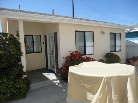 Cottage with covered patio table 