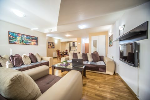Comfort Apartment | Living area | Flat-screen TV