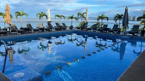 Outdoor pool, open 9:00 AM to 9:00 PM, pool umbrellas, sun loungers