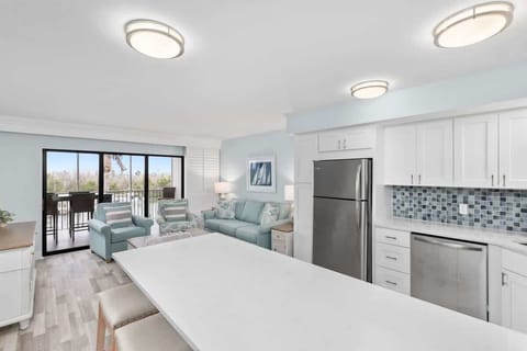 Gorgeous and expansive living room overlooking serene marina and bayside
