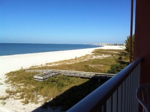 Enjoy the Gulf of Mexico view while walking along the sandy beach.