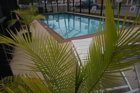 Seasonal outdoor pool, open 9:00 AM to 9:00 PM, pool umbrellas