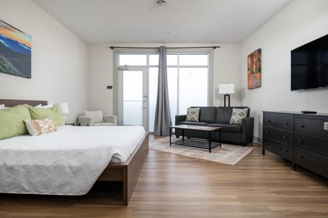 Bright and airy bedroom with cozy seating and natural light