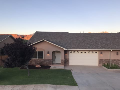 Front of house at sunset.