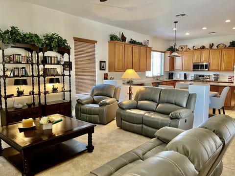  Leather reclining sofas and chair at family room.