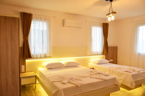 Standard Triple Room | Minibar, iron/ironing board, free WiFi, bed sheets