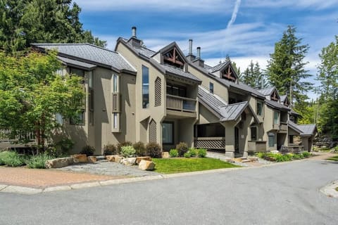 - Modern alpine townhouse exterior blending rustic charm and comfort  
- Prime Whistler location near lifts, trails, and village attractions  
- Stylish mountain retreat offering year-round outdoor adventure access  
