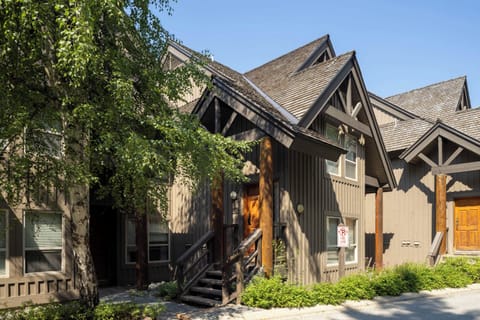 - Beautiful townhouse exterior with rustic wood design and charming alpine architecture  
- Surrounded by lush greenery and nestled in a peaceful mountain community setting  
- Ideal location for guests seeking comfort adventure and stunning natural 