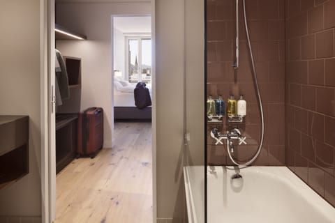 Rainfall showerhead, designer toiletries, hair dryer, towels