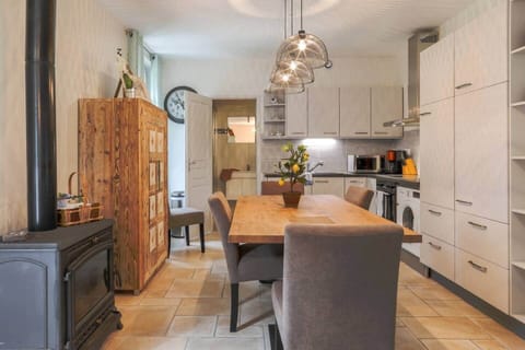 Ground floor kitchen, dining area, bathroom in the back ground