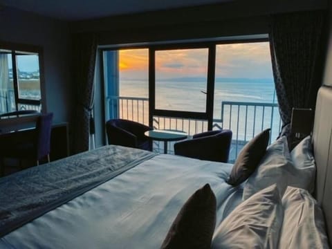 Desk, laptop workspace, blackout drapes, iron/ironing board