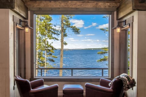 Grab a glass of wine or read a book with an astounding view in the main floor living room