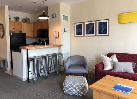 Bar seating area adjacent to living room