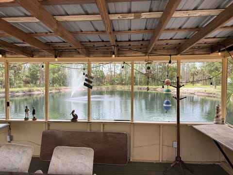 Screen porch overlooking lake and fountain