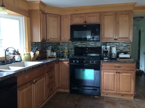 Clean and well-stocked 1st floor kitchen with sunny southern exposure. 