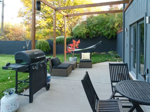 We invite you to use the grill, bistro seating, and hammock