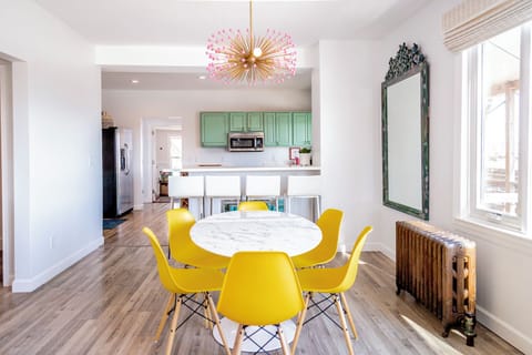 Dining Table and Bar-height Counter Seating—The dining table seats six, the counter seats four. 