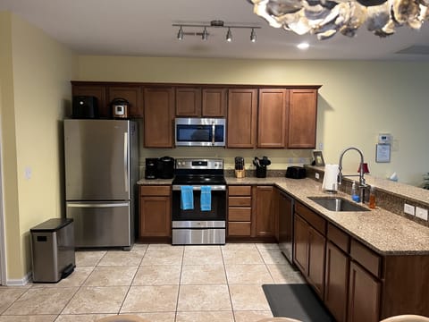 New quartz countertops installed with new sink and faucet.