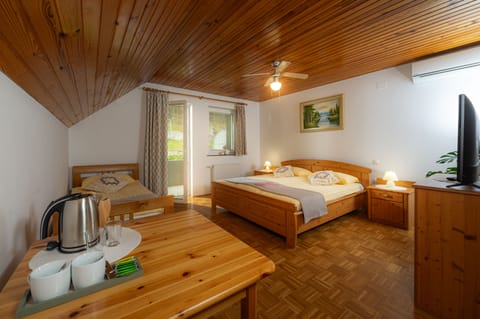 Comfort Triple Room, Non Smoking, Garden View | Desk, free WiFi, bed sheets