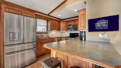 Full size fridge/freezer, dishwasher, microwave, stove, coffee machine and TV.