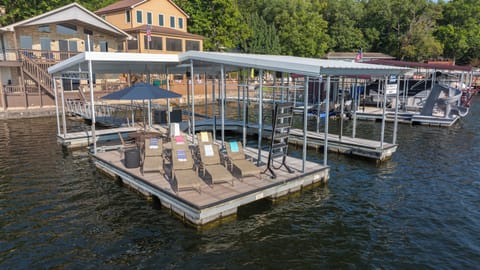 Private dock w/ 12'x30' boat slip, PWC lift, 6 loungers and table w/ 4 chairs.