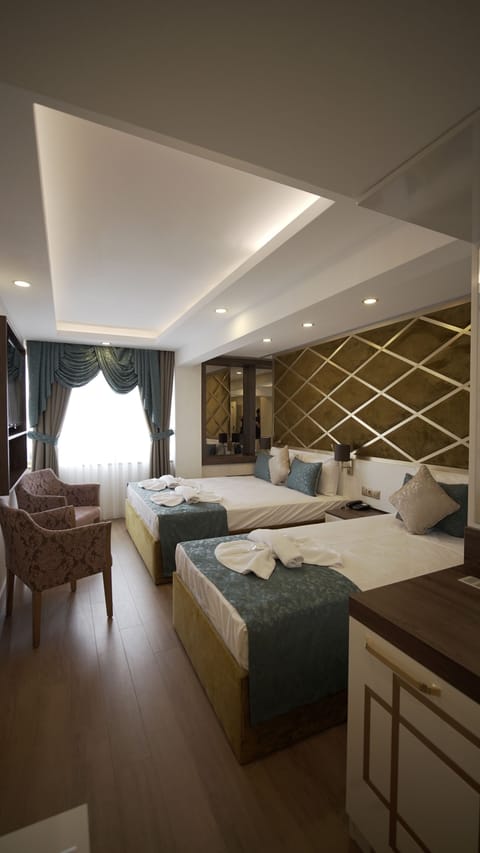 Standard Triple Room, City View | Minibar, in-room safe, soundproofing, free WiFi