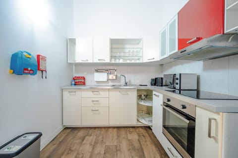 Apartment, 2 Bedrooms | Private kitchen | Fridge, microwave, stovetop, cookware/dishes/utensils