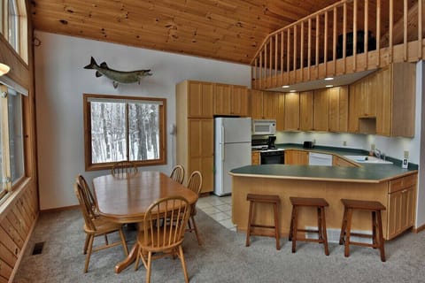 Snack Bar or dining table are handy just off the living area so no need to miss any fun.