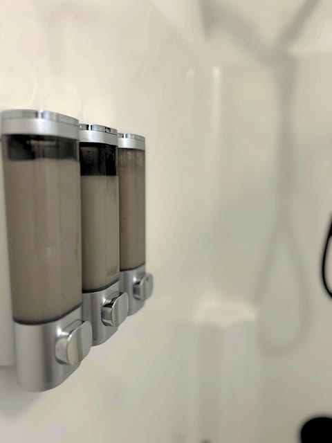 Combined shower/tub, towels, soap, shampoo