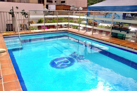 Outdoor pool, open 9:00 AM to 9:00 PM, pool umbrellas, sun loungers
