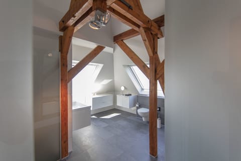 Suite (OnTheTop) | Bathroom | Hair dryer, bathrobes, slippers, towels