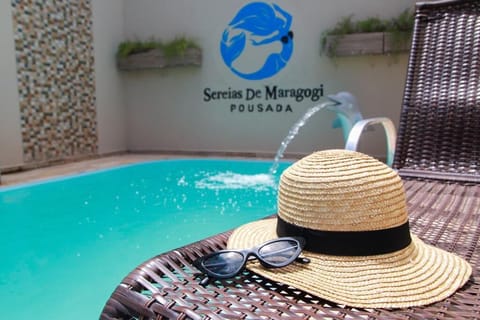 Outdoor pool, open 8:00 AM to 8:00 PM, sun loungers