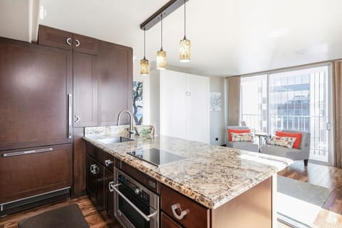 Gourmet kitchen with Thermador fridge/freezer, induction stove top, microwave/convection oven.  Plenty of prep and eating space and storage.  All you need for home-cooked meals.