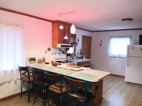 4 Comfortable Bar seats  & counter space for food prep