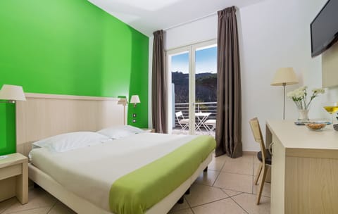 Double Room | Minibar, in-room safe, desk, iron/ironing board