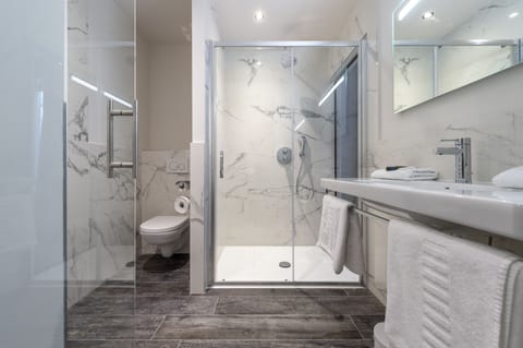 Deep soaking tub, rainfall showerhead, towels