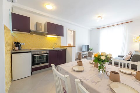 Apartment, Sea View | Private kitchenette | Fridge, coffee/tea maker, cookware/dishes/utensils, dining tables