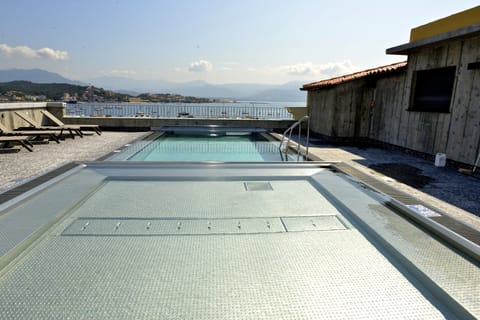 Seasonal outdoor pool, open 10:00 AM to 8:00 PM, sun loungers