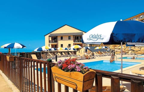 Relax by the outdoor pool in the summer