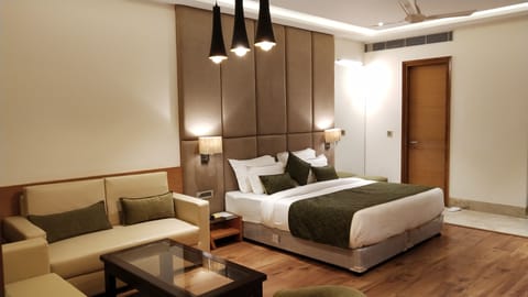 Suite Of Orchid | Living area | 52-inch flat-screen TV with digital channels, TV