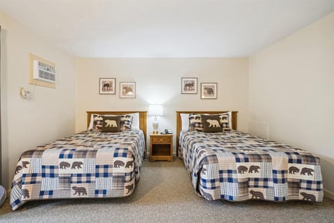 This bedroom offers 2 extra long full sized beds.