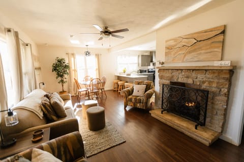 living room with plenty of seating, couch pulls out to queen size sleeper sofa