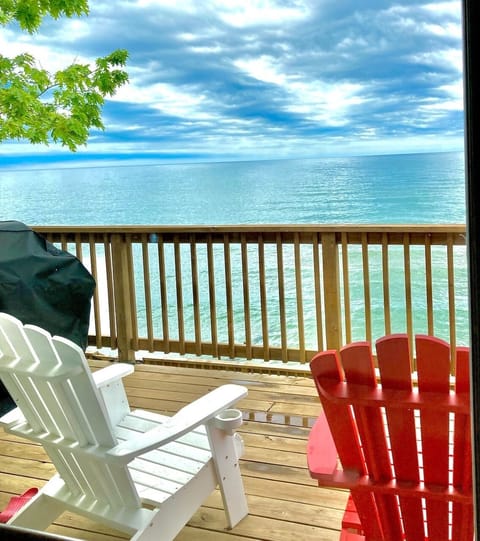 Adirondack on upper deck overseeing the lake