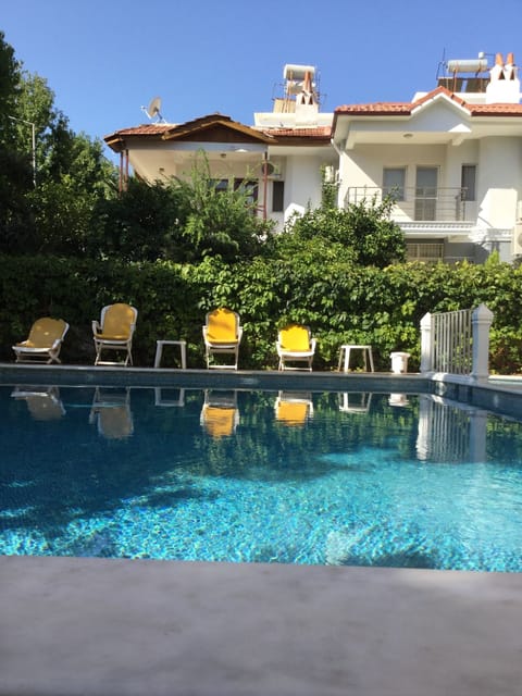 Seasonal outdoor pool, open 9:00 AM to 7:00 PM, pool umbrellas