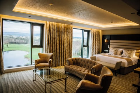 Superior Suite | Living area | 50-inch Smart TV with cable channels, TV, streaming services