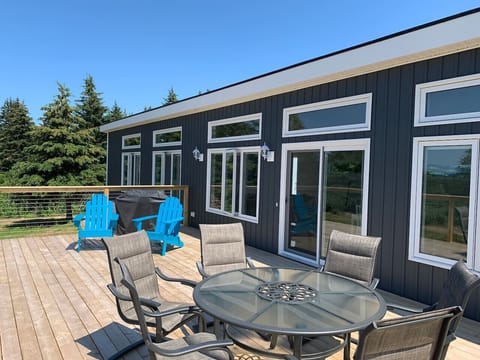 The Blue Pearl is a modern  4.5 star fully equipped vacation home with an open concept living area, views from every room and a giant sundeck for watching amazing Cape Breton sunsets. It is 1of 3 homes at Colindale Beach Villas.