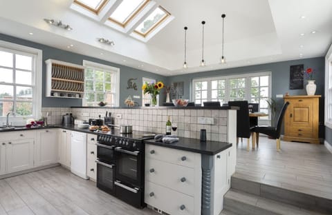Ground floor: Fully equipped kitchen and dining room with french doors that lead out into the garden
