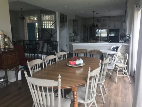 Inside table seats 10 plus , high chair and 2 barstools.  Another table nearby.
