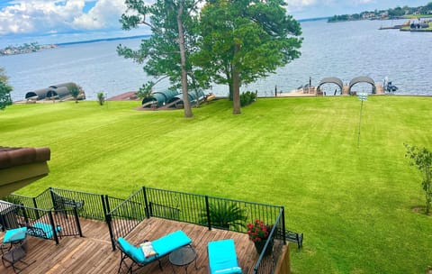 You can see for miles!   Open water view.
Huge deck, yard, covered boat dock.  